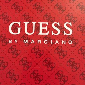 Gently worn Guess snake pattern pumps