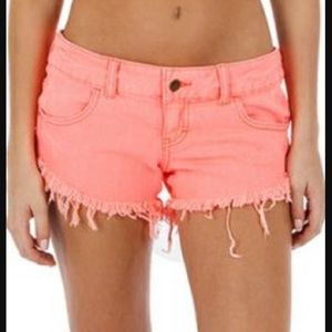 Distressed neon orange billabong shorts
