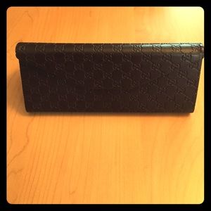 Gucci sunglass case.