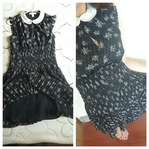 A black dress with stars printed and a collar