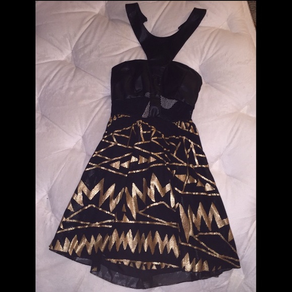 Black and gold dress that ties around the neck