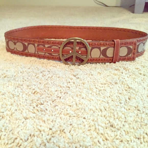 Coach belt. Brown leather with peace sign buckle