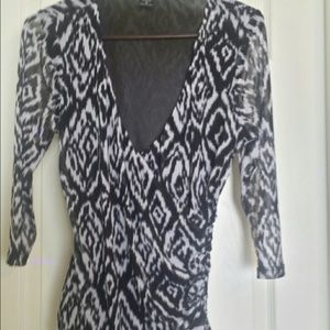 Black & white knit wrap top.