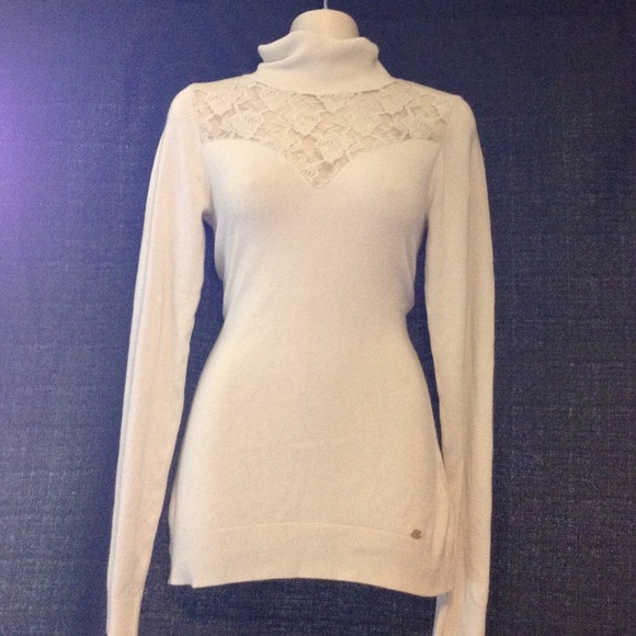 Off white cream turtle neck sweater.