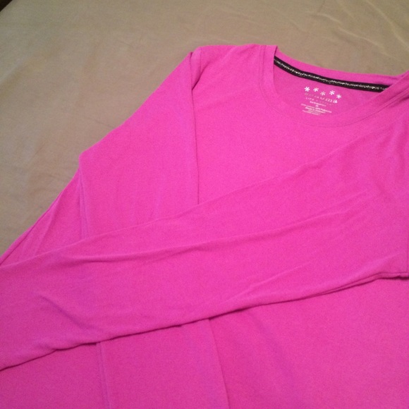 Long sleeved purple/pink shirt.