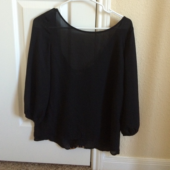 Black top with cheetah bow in back.