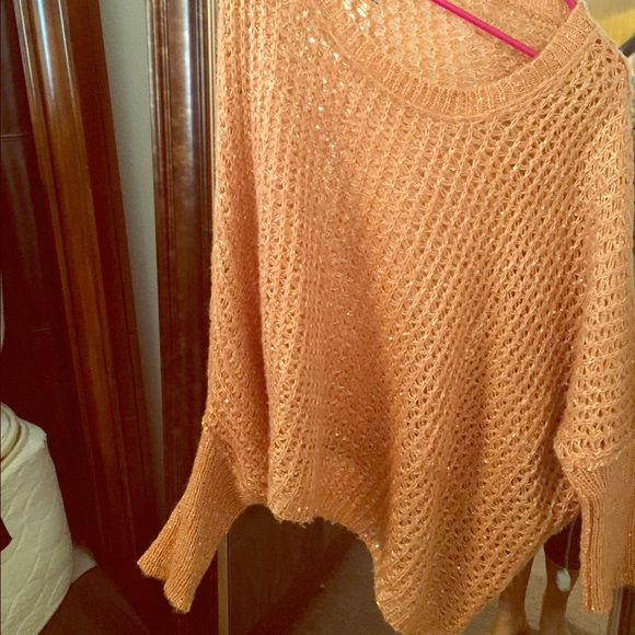 Orange sparkly hold off the shoulder sweater.
