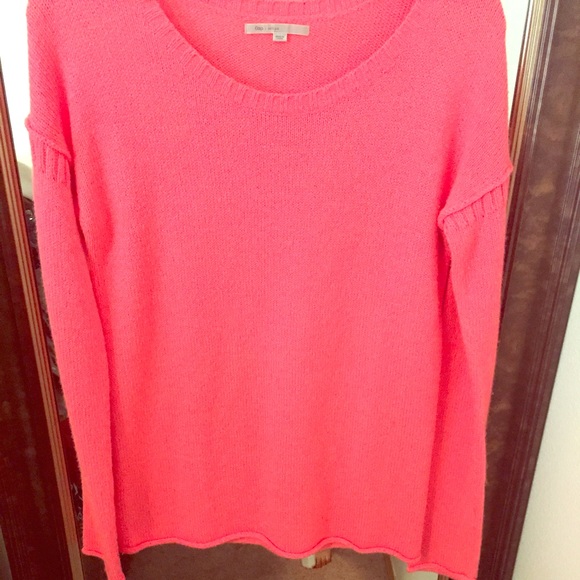 Vibrant pink sweater.