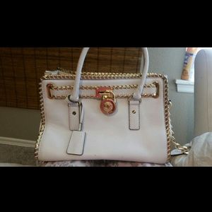 White Michael Kors purse with gold trim