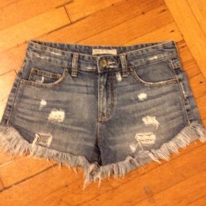 Free People Dolphin hem cuttoffs