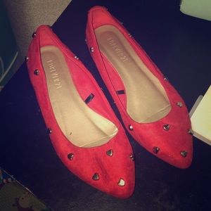 Red pointed toe heart studded flats