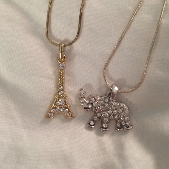 Gold Eiffel Tower & Silver Elephant Necklaces.