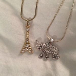 Gold Eiffel Tower & Silver Elephant Necklaces.