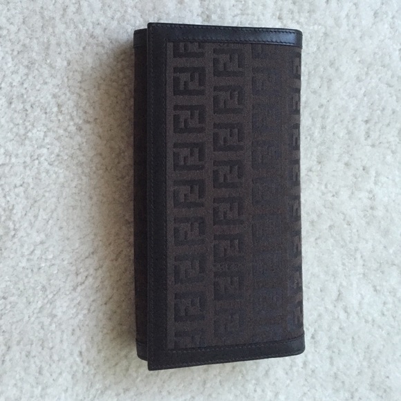 Real Fendi fabric and leather never used wallet.