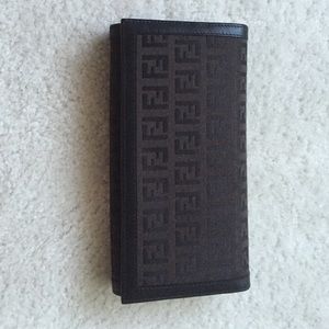 Real Fendi fabric and leather never used wallet.