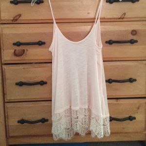 Baby pink tank with lace trim.