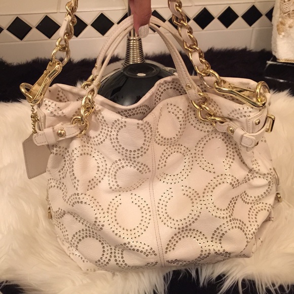White and gold coach purse