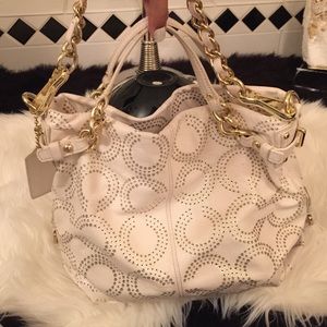 White and gold coach purse