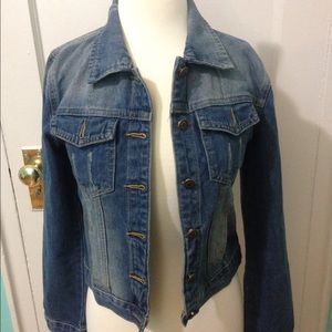 blue denim jacket with distress/fits sml. and med.