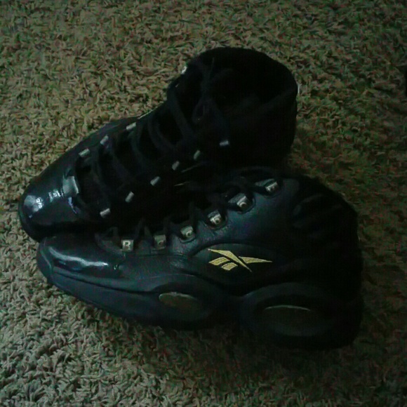 Men's black and gold Reebok