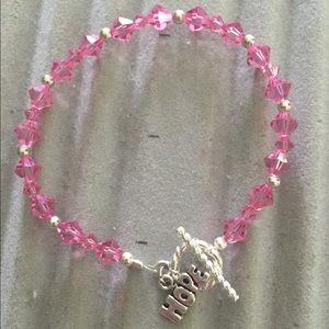 Pink Swarovski crystal bracelet with "hope" charm.