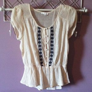 An off white tunic top.