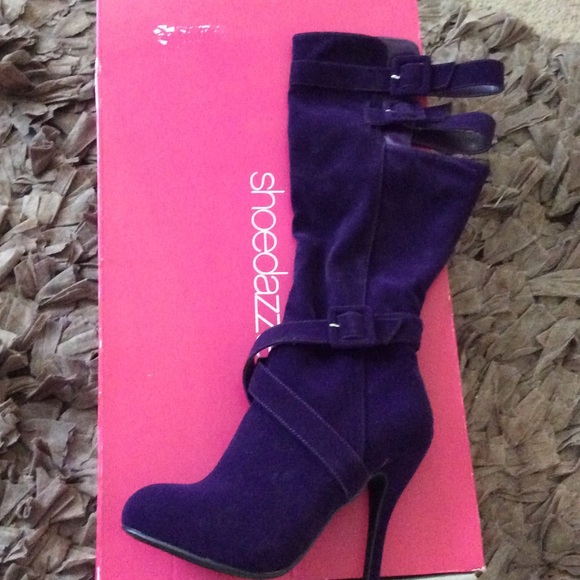 Velvet purple knee high boots.