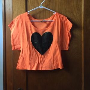 Never warn orange and black cropped top