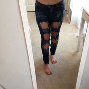 Dark distressed ripped jeans