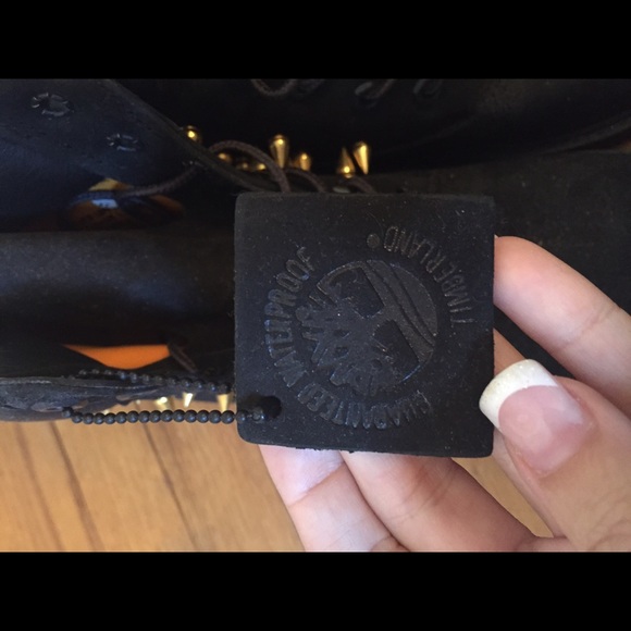 Customized black studded Timberland boots