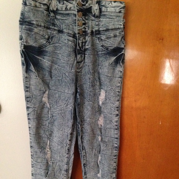 High waisted bleached jeans .