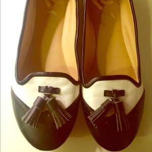 Black and white tasseled loafers
