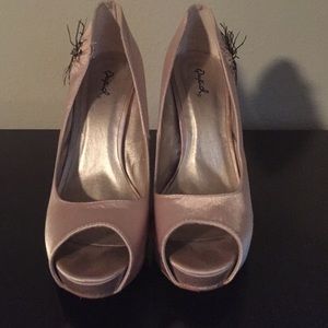 Baby pink high heels with feathers
