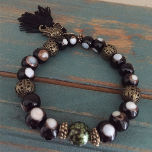 Black and gold "evil eye" glass bead & elephant