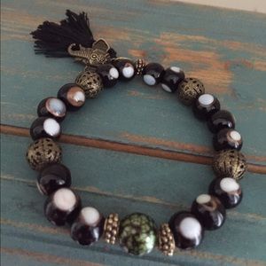 Black and gold "evil eye" glass bead & elephant