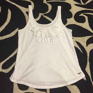 Scoop neck white tank with ruffles on the breast