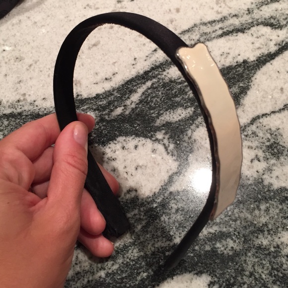 Black headband with white accent piece