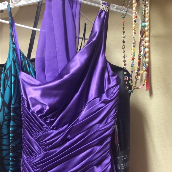 Purple evening gown with slit and ruching
