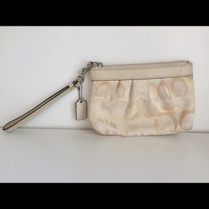Coach cream colored logo wristlet