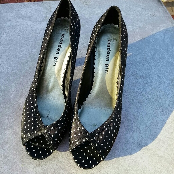 Madden girl high heels shoes with red trim sides.