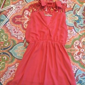 Knee length coral dress.