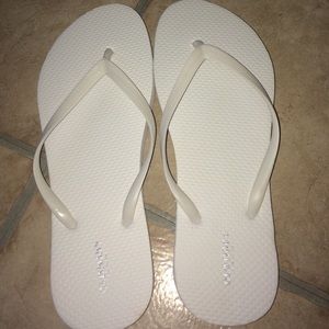 Brand new white flip flops never worn (too small)