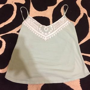 Turquoise tank with white lace detailing