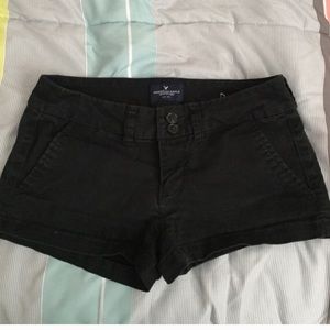 Two tops and a pair of black shorts