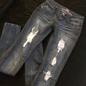 Medium Wash Destroyed Almost Famous Jeans