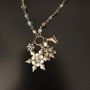 Snowflake and ice skate charm necklace