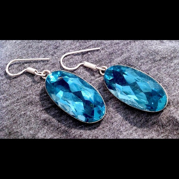 Genuine Stunning oval shape blue topaz earrings.