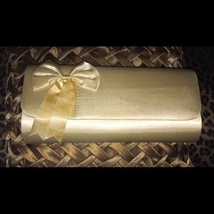 Brand new champagne satin bow clutch with string