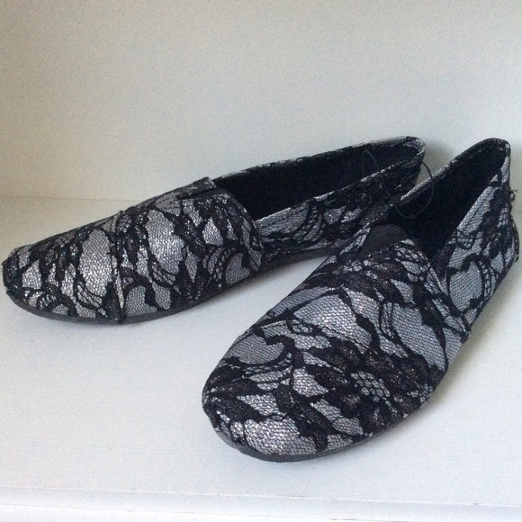 Black and silver flats