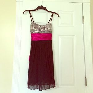 Black dress with pink bow and zebra print top